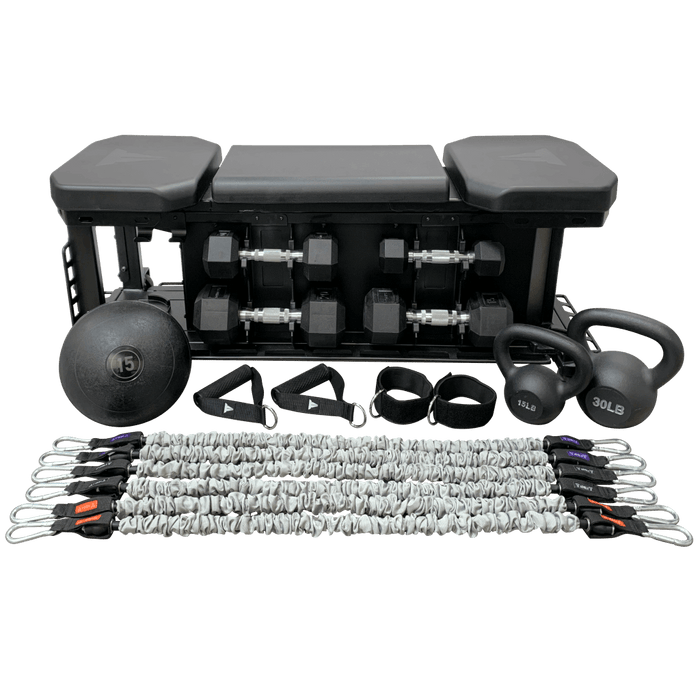 FXD all-in-one workout bench with dumbbells, kettle bells, slam ball, and resistance bands.