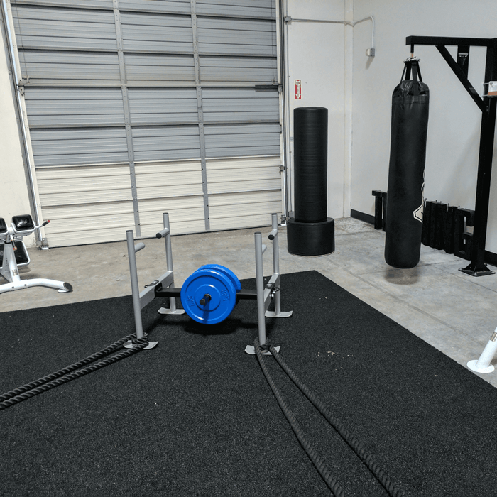 Throwdown Super Sled with two 35 lb weights mounted. Two battle ropes attached to feet.