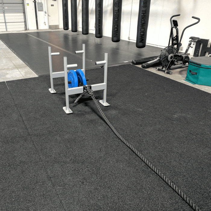 Throwdown Super Sled with two 35 lb weights mounted. Battle rope attached to front ring.