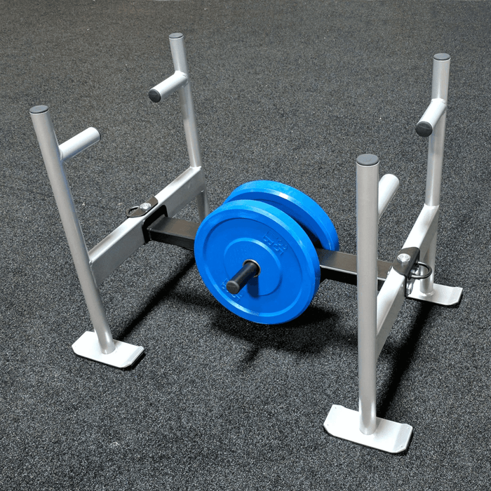 Throwdown Super Sled with two 35 lb weights mounted. On padded gym floor.